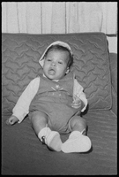 Set of photographs including Missie Stevenson's baby, a wedding, Jackson Barber Shop advertisements, and father and son dodgeball: image 001