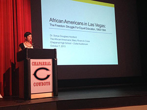 Presenting on staff with podium and powerpoint