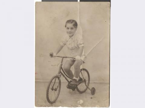 Photograph of Maurice Behar a bicycle, August 24, 1942