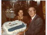 Photograph of Joyce and Jerry Mack with cruise ship cake celebrating their anniversary, March 30, 1979