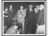 Moe Dalitz holding a monkey at his birthday party, December 23, 1979