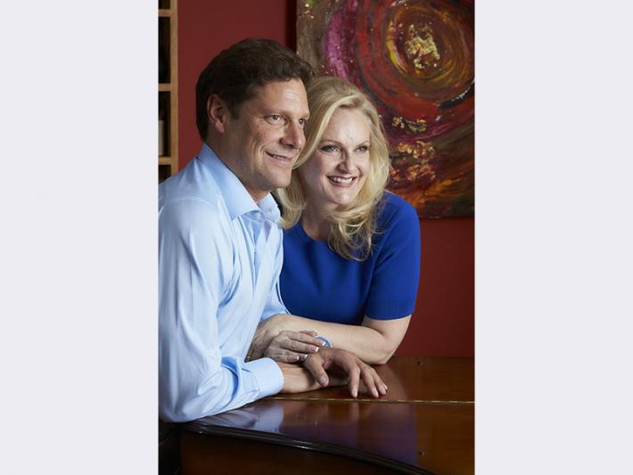 David and Heidi Straus pose in the "House of Straus" at 409 Rosemary Lane in Las Vegas.