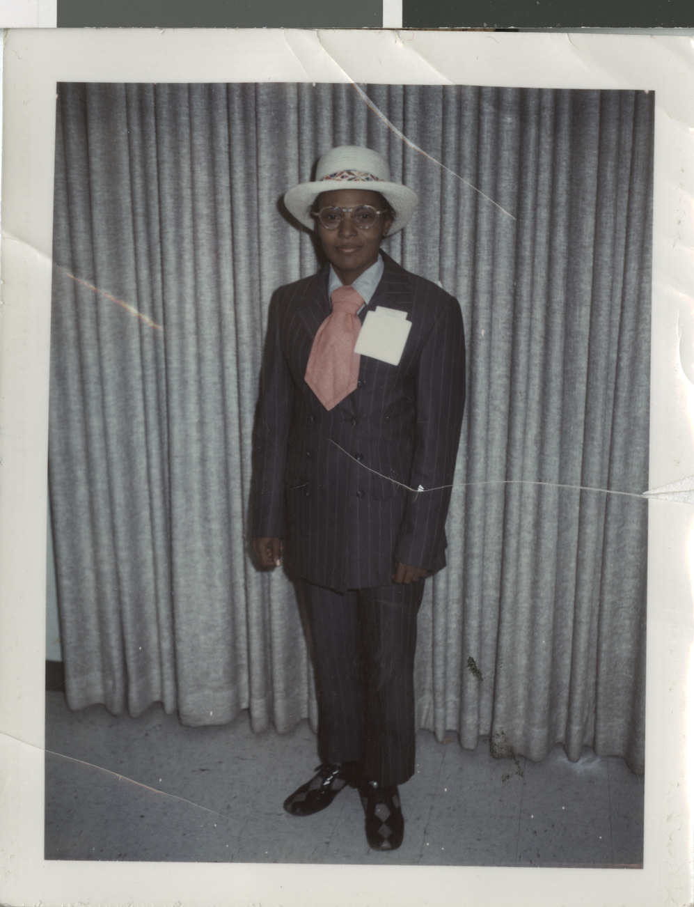 Color photograph of Ruby dressed in a men's suit for Halloween, no date