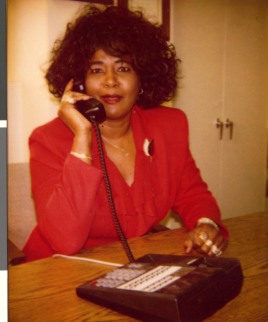 Marzette Lewis at her desk, Image 02