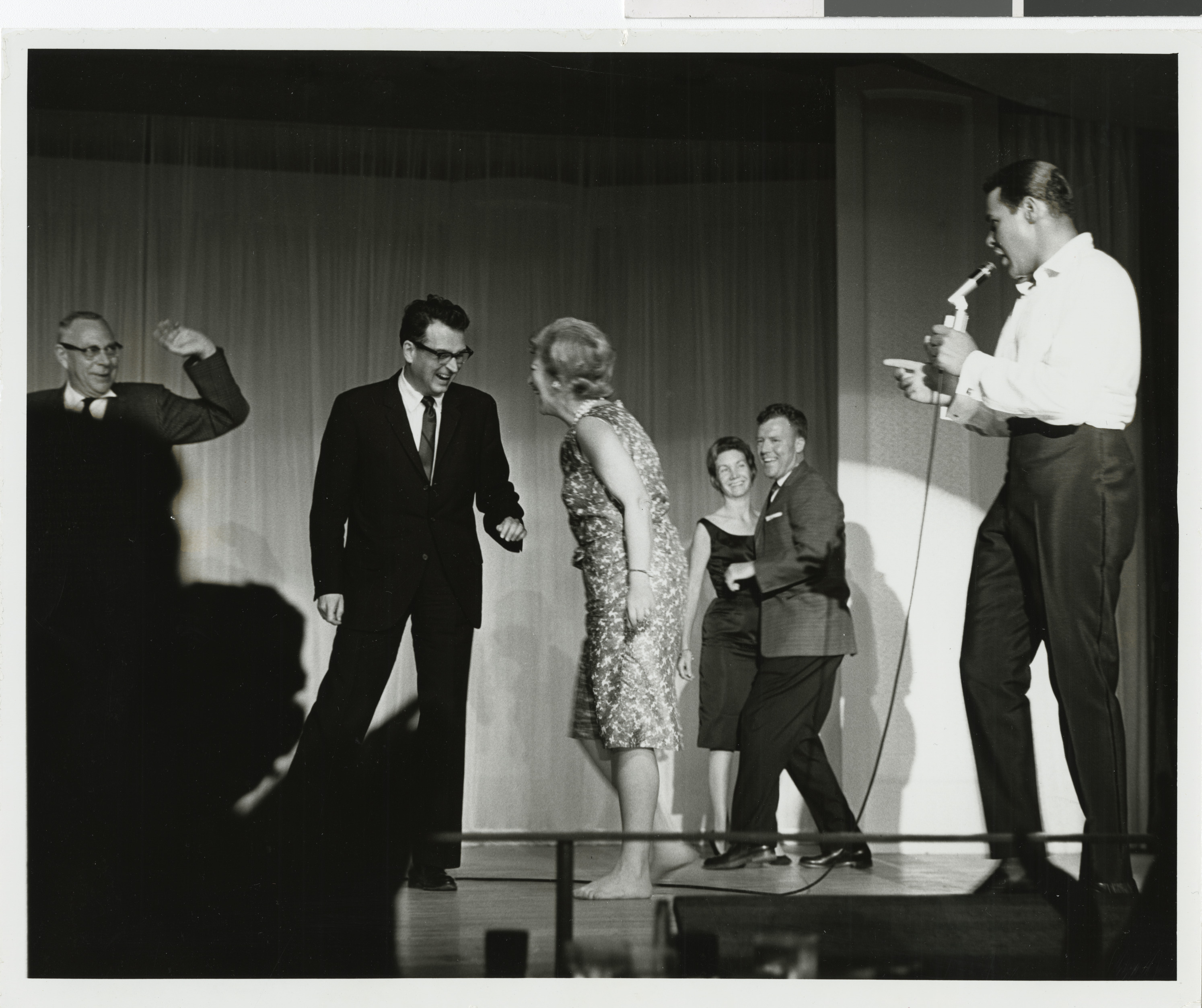 Photograph of Chubby Checker performing onstage at the Sands Hotel, August 1962