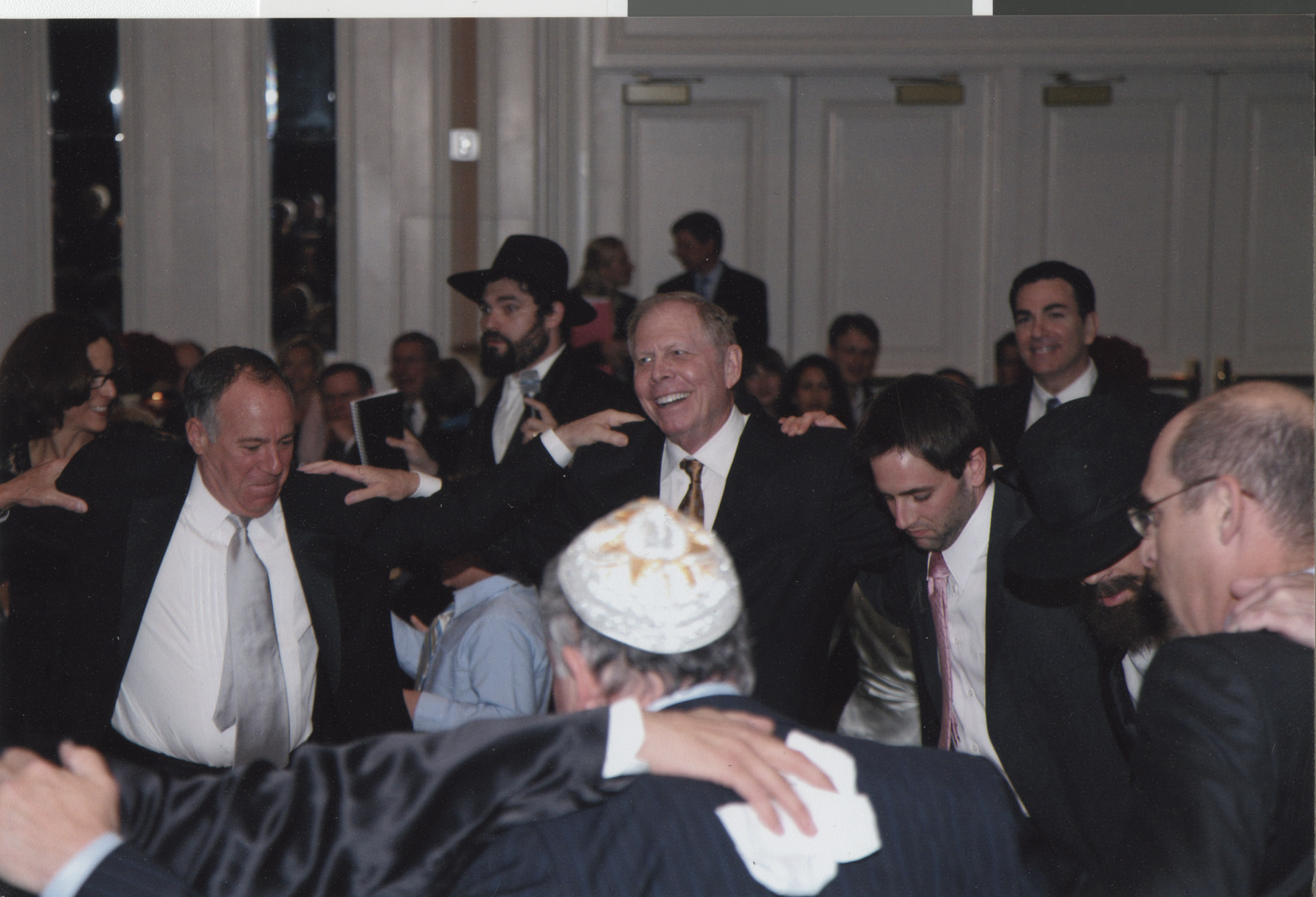 Photograph of Stuart Mason dancing with a group, April 2008