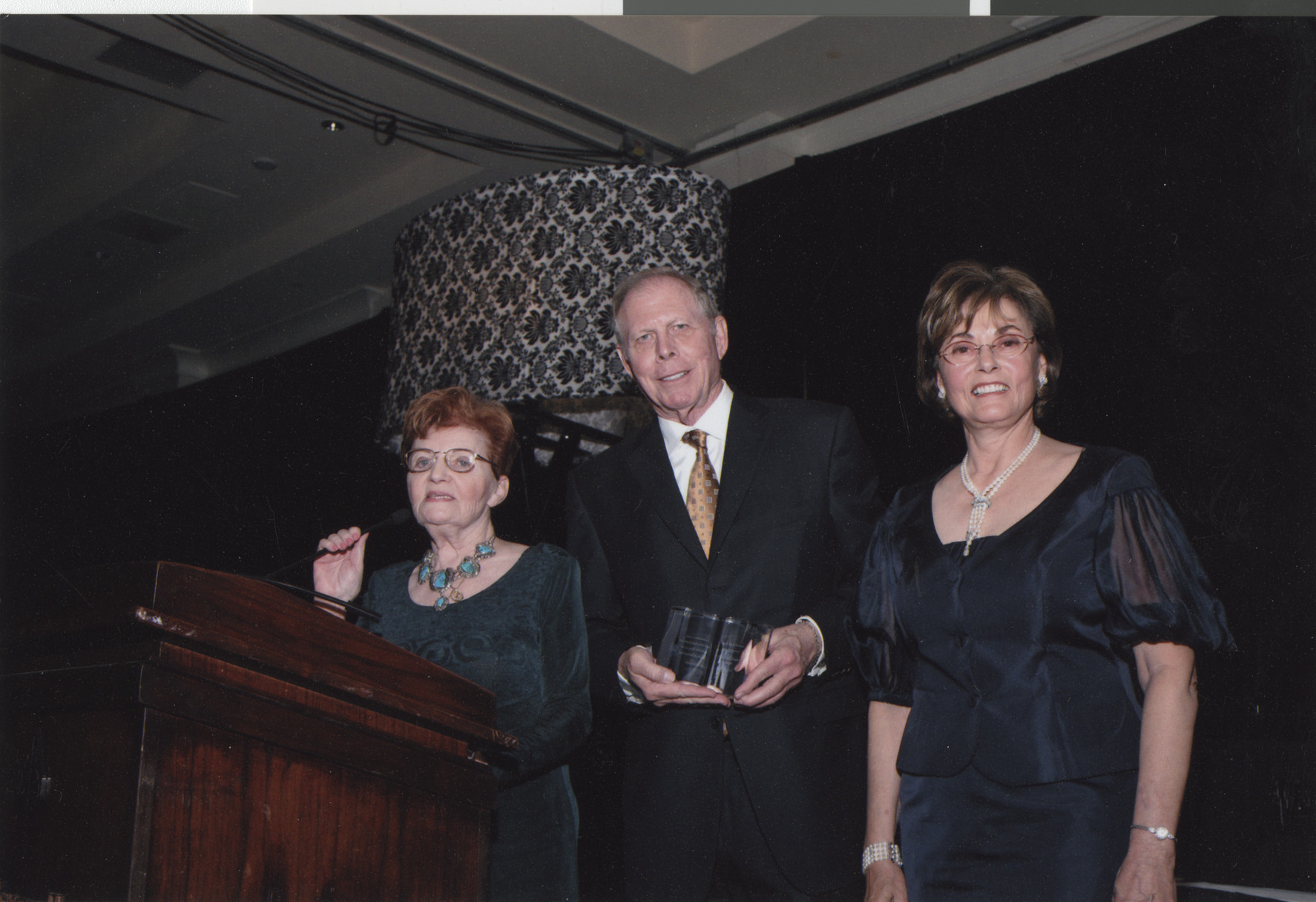 Photograph of Stuart and Flora Mason receiving an award, April 2008