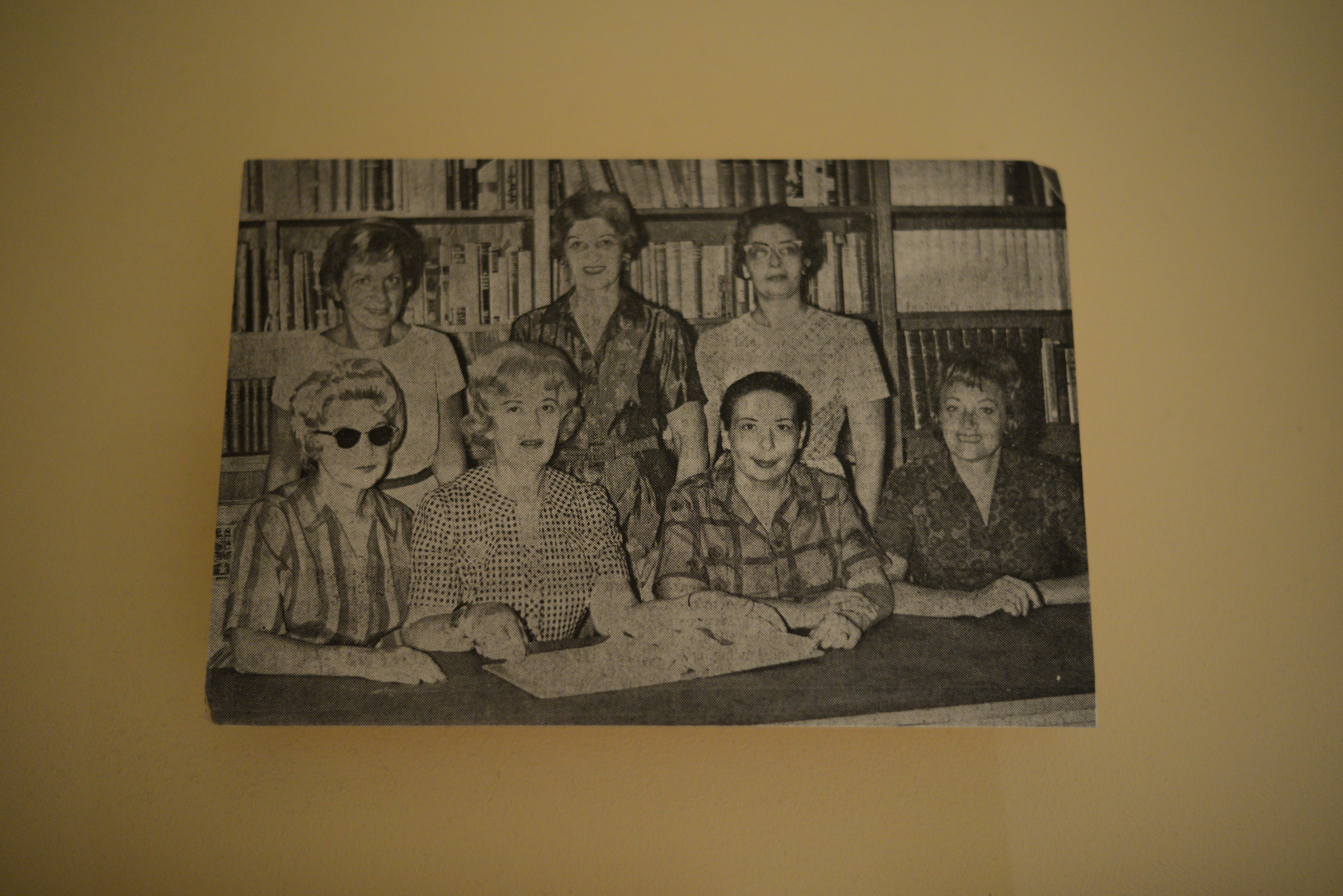 Photograph of women at a library, date unknown