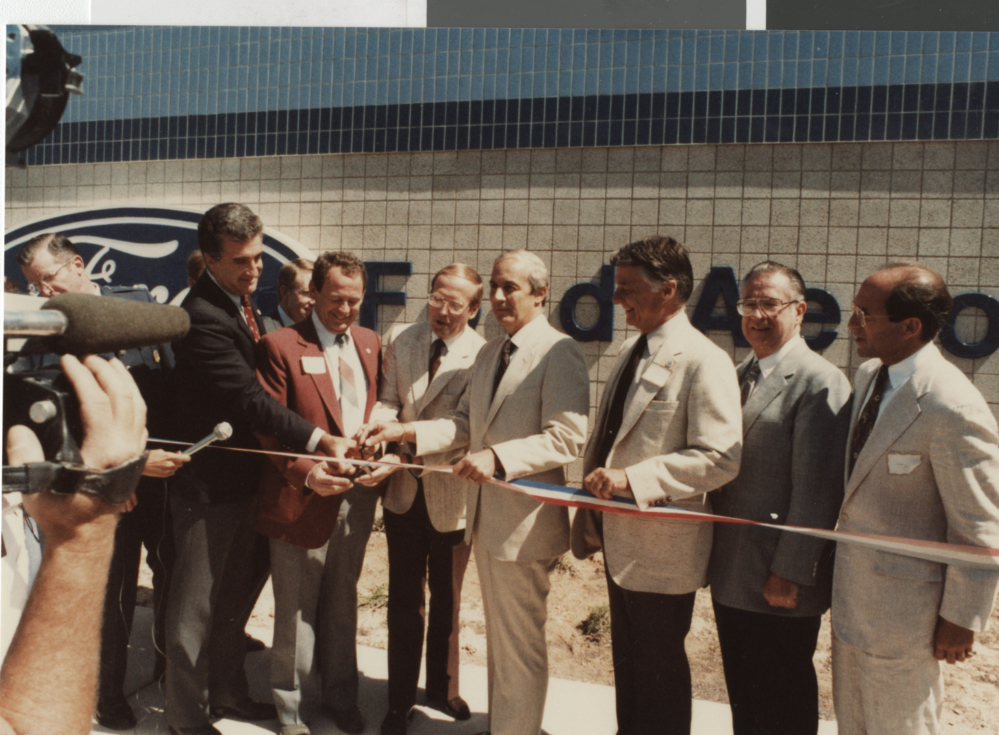 Photograph of Ron Lurie at a ribbon cutting at a Ford Motor Company facility, circa 1978