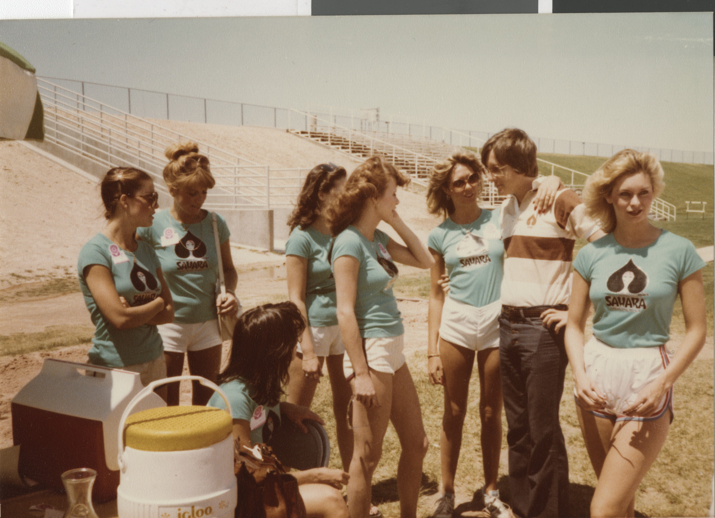 Photograph of a group of women wearing Sahara hotel t-shirts