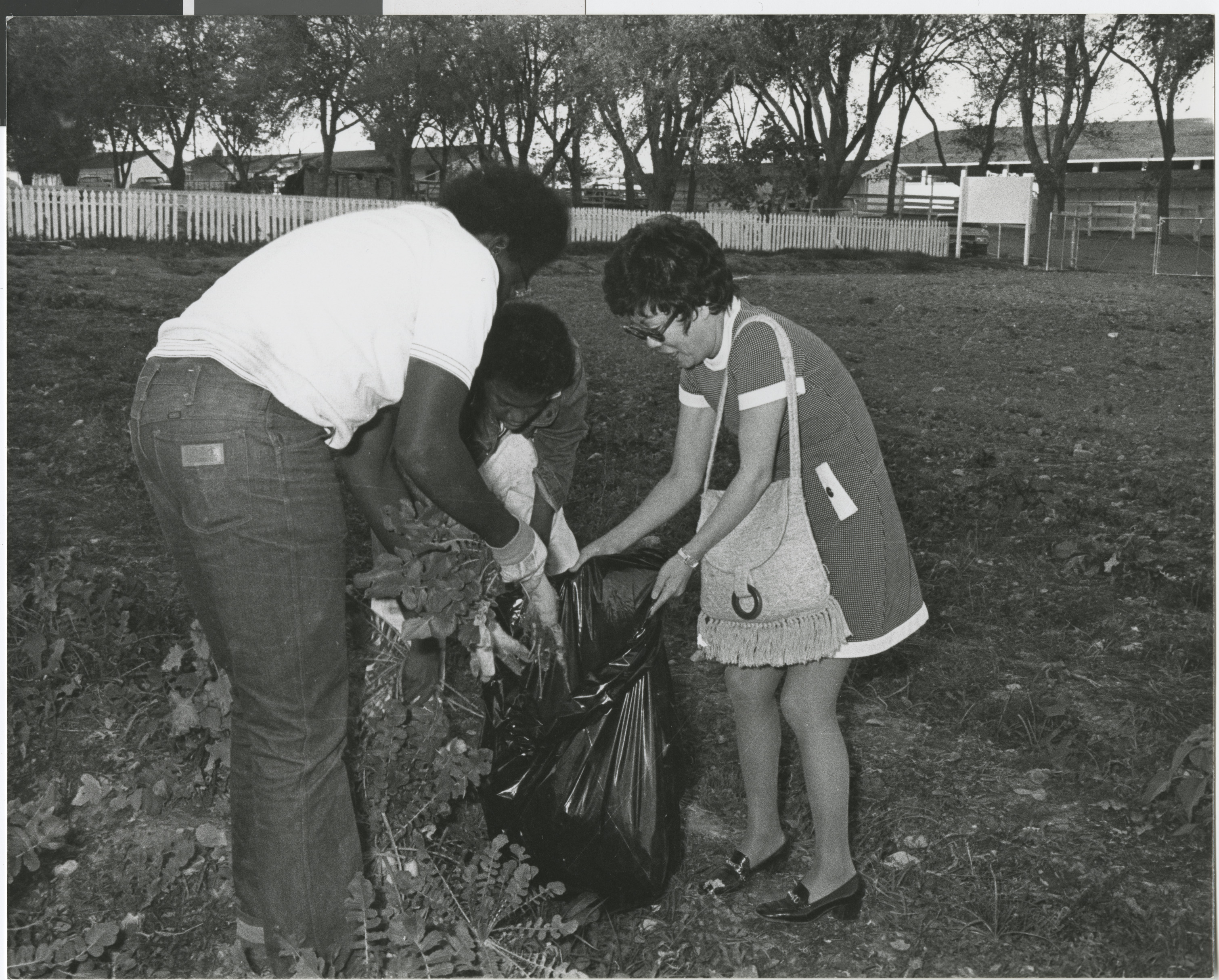 Photograph of community members planting trees and vegetables