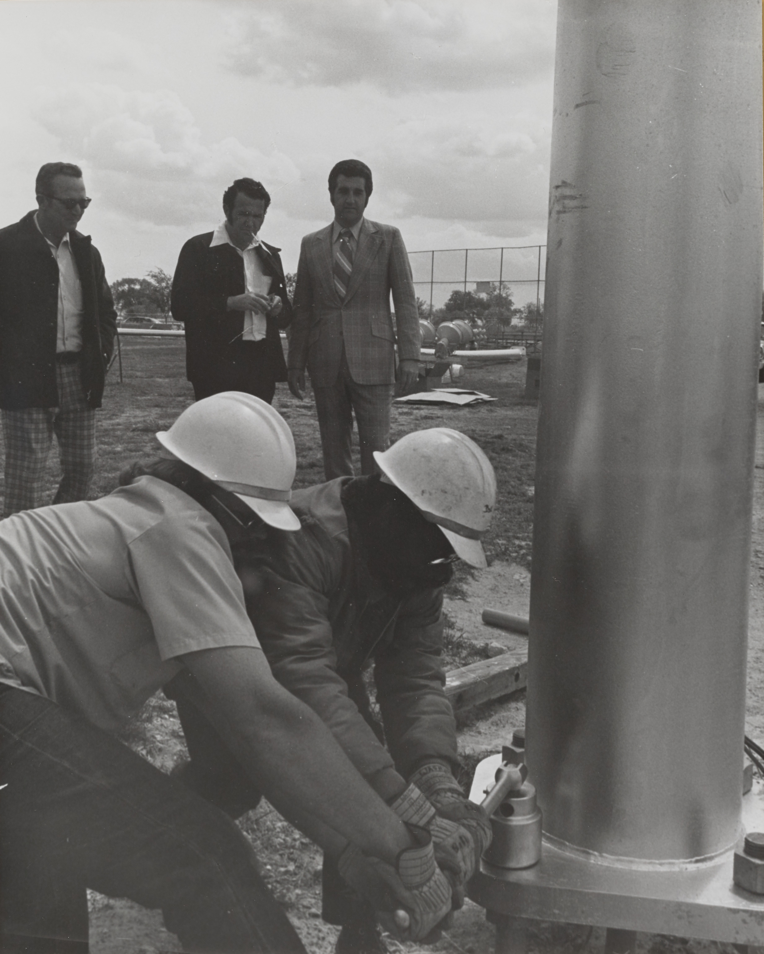 Photograph of Ron Lurie at installation of utility pole