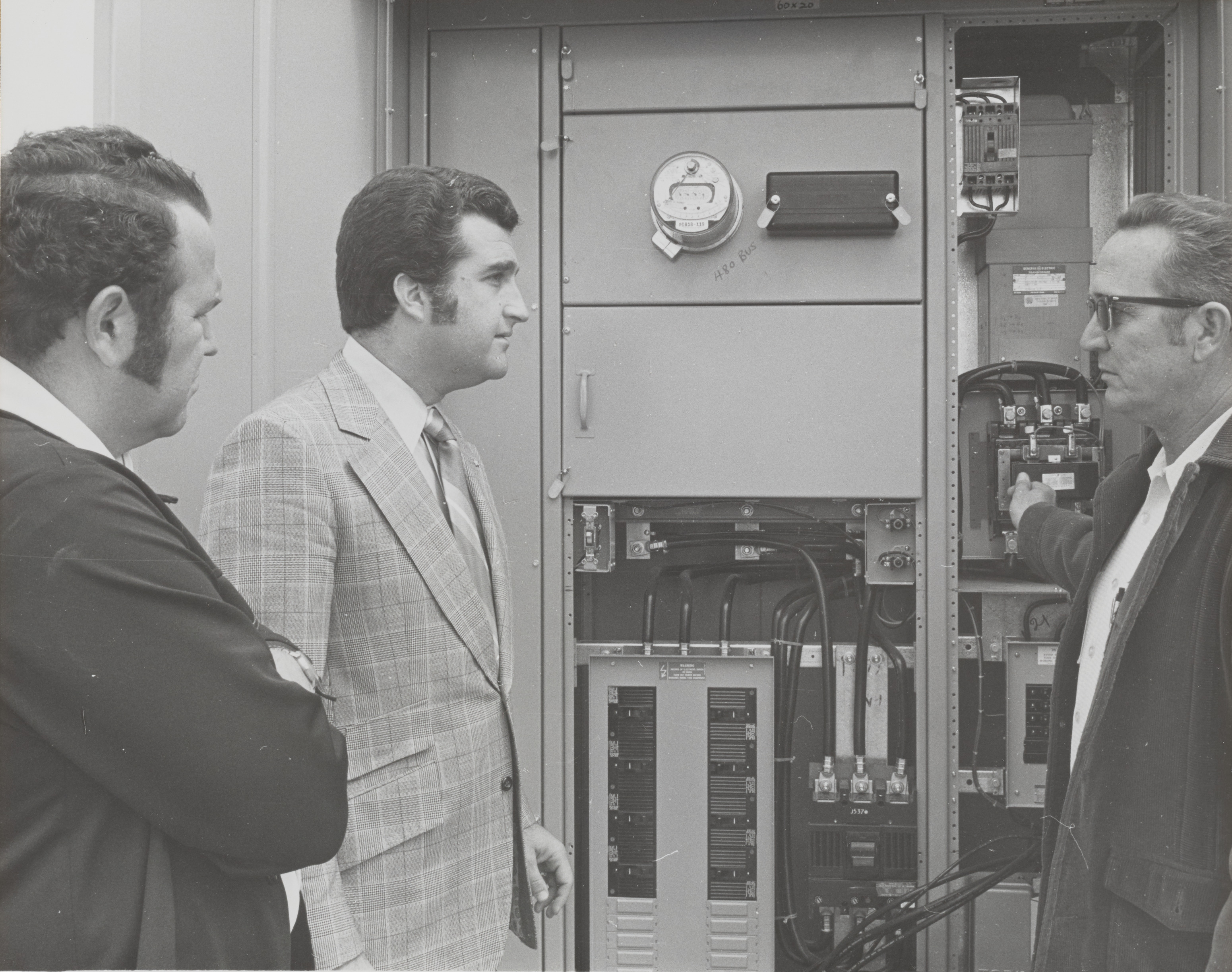 Photograph of Ron Lurie at junction box for utility pole