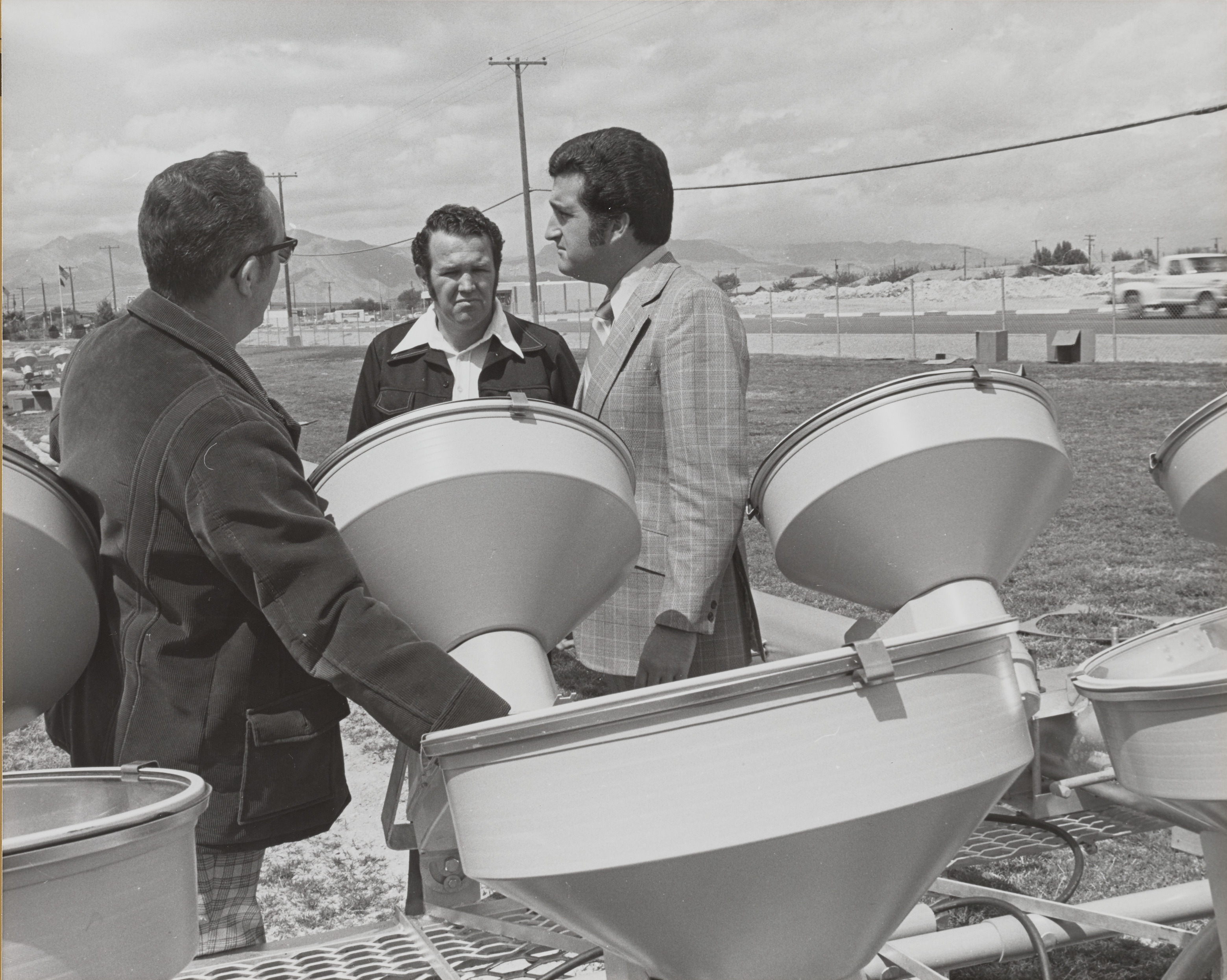 Photograph of Ron Lurie and others at utility light installation