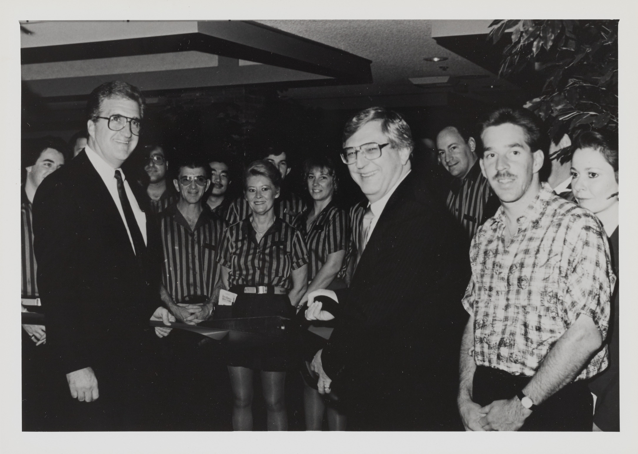 Photograph of Ron Lurie at ribbon cutting event for Tony Roma's, 1990