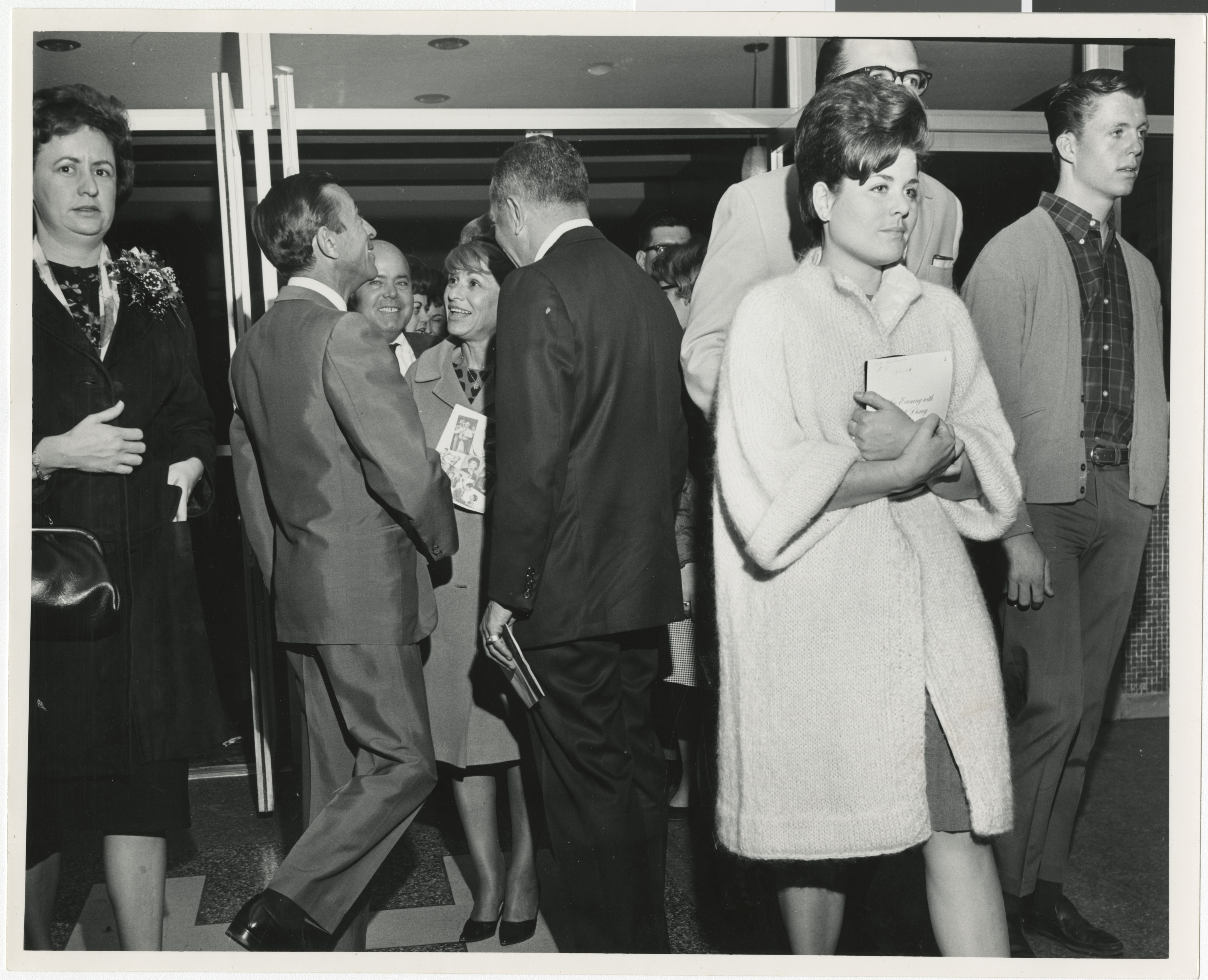 Photograph of Edythe Katz (center) at Cinemas 1-2-3