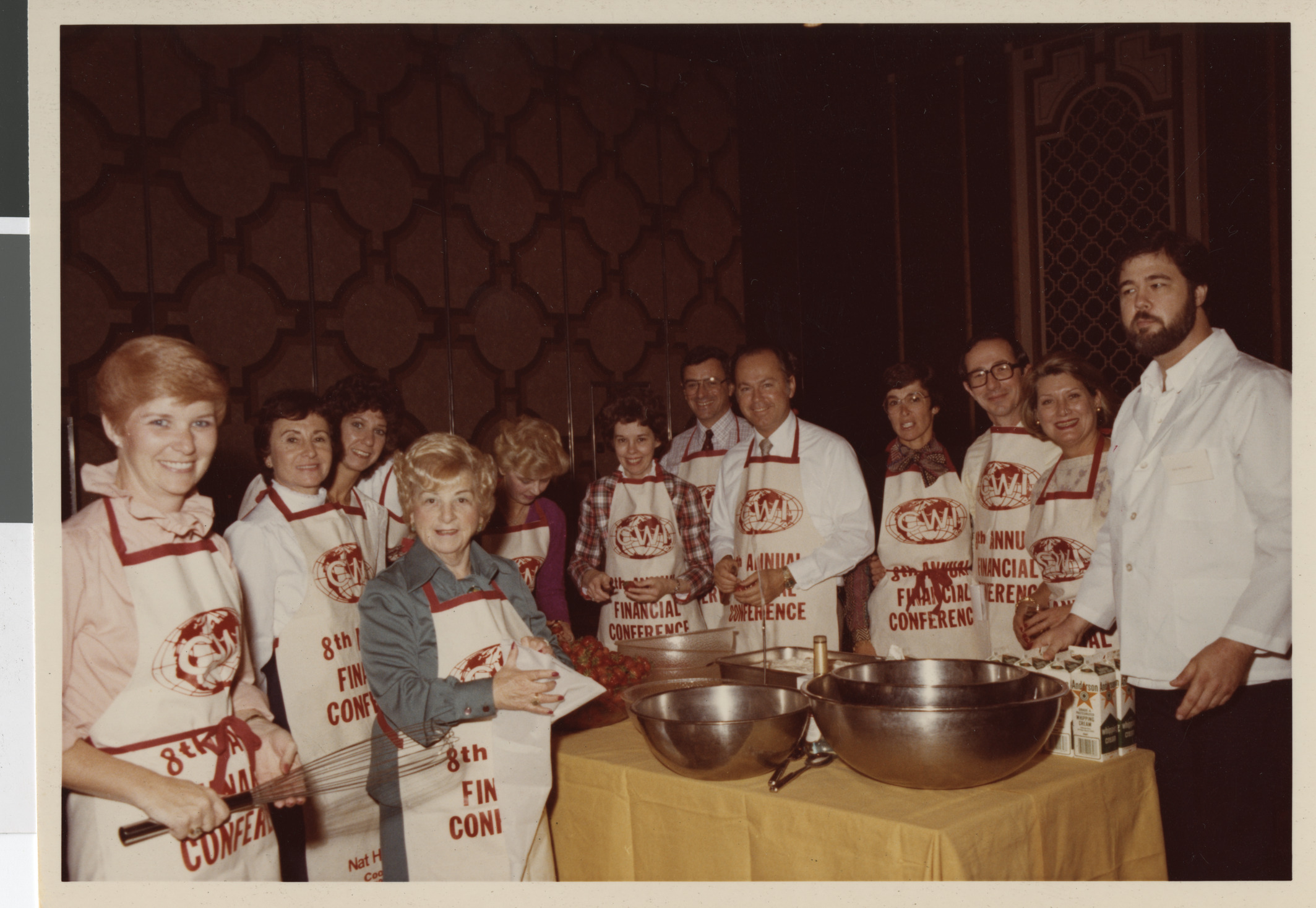 Photograph of Sylvia Hart with students in a cooking school class
