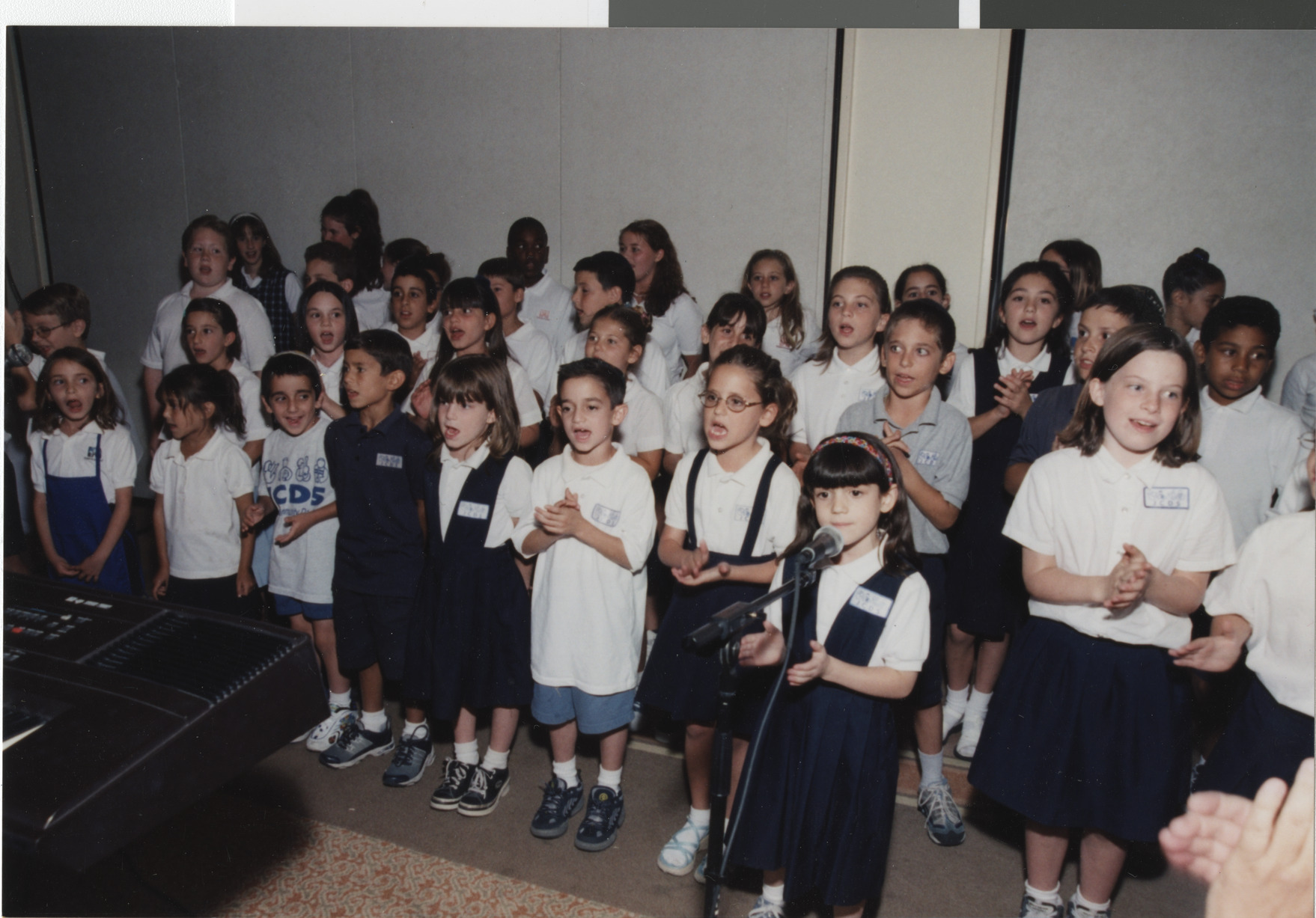 Photograph of a group of children singing