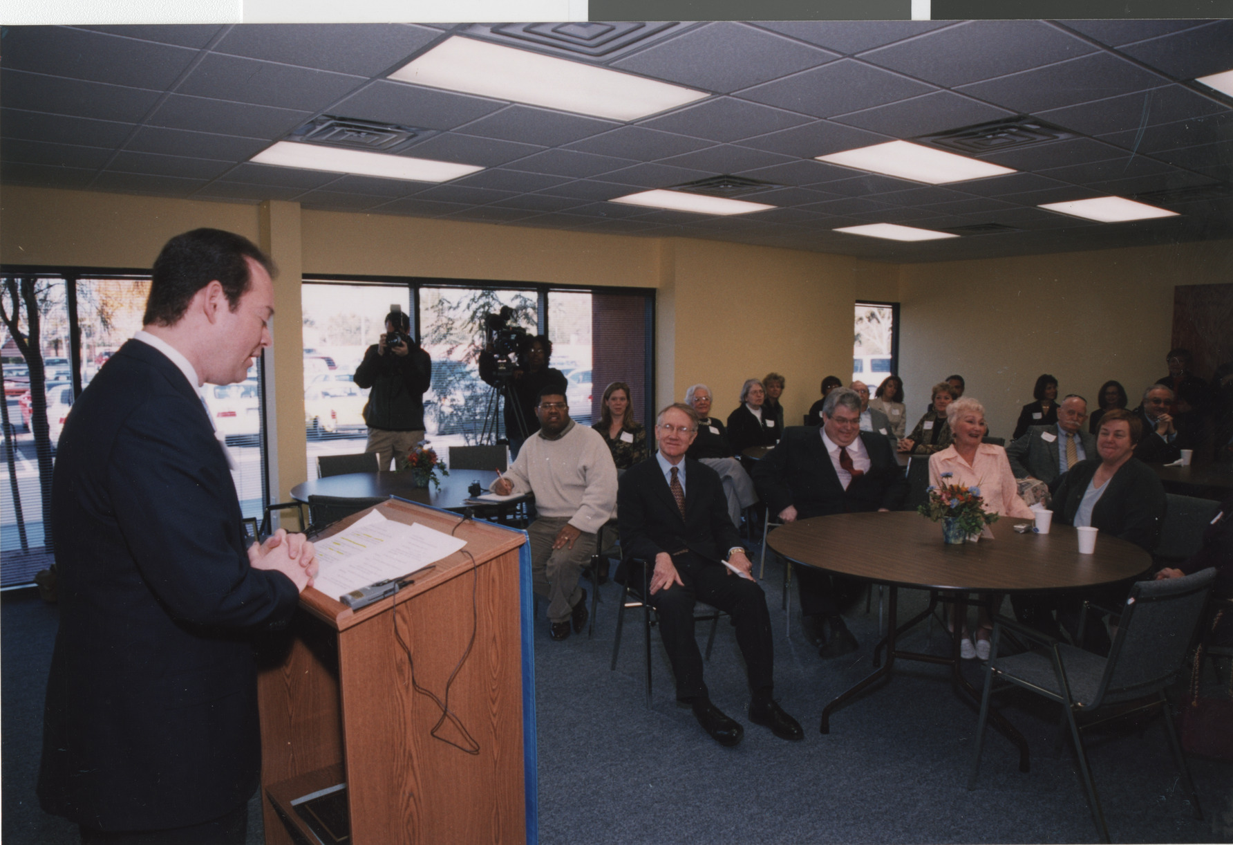 Photograph of Michael Novick addressing a crowd
