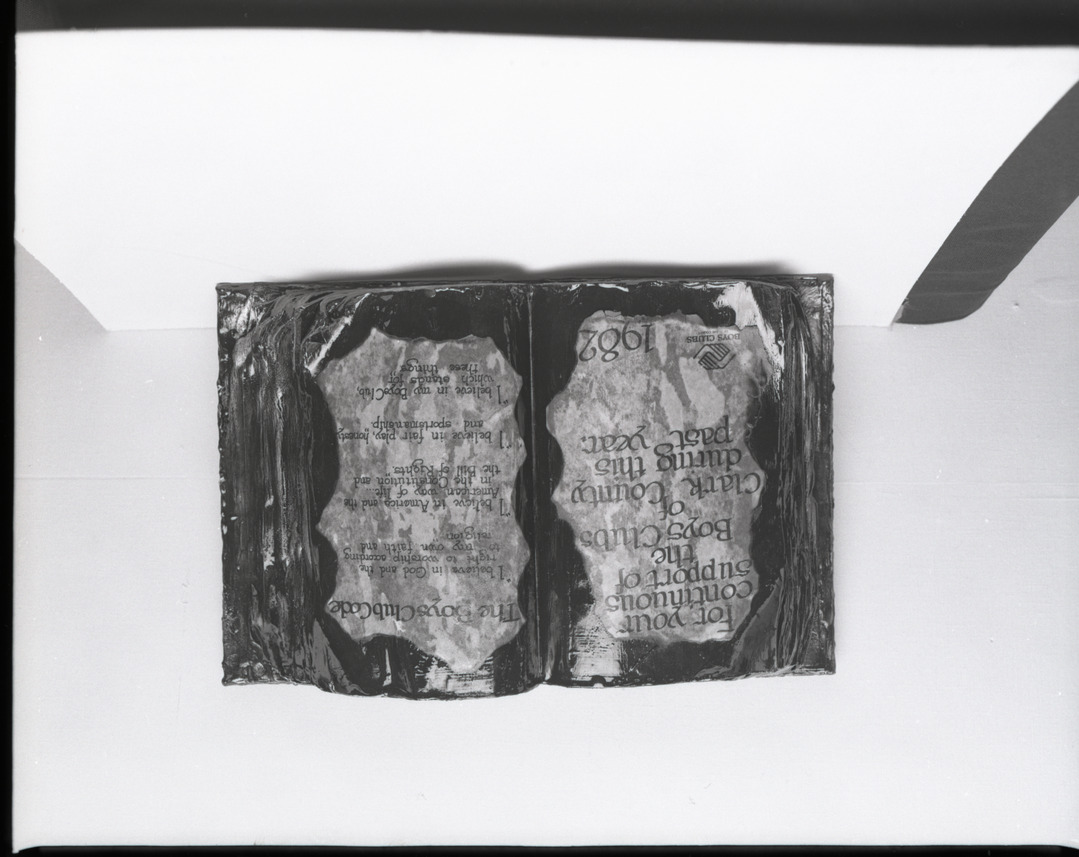 Film negative of book-shaped plaque for Moe Dalitz from the Boys Clubs of Clark County, 1982