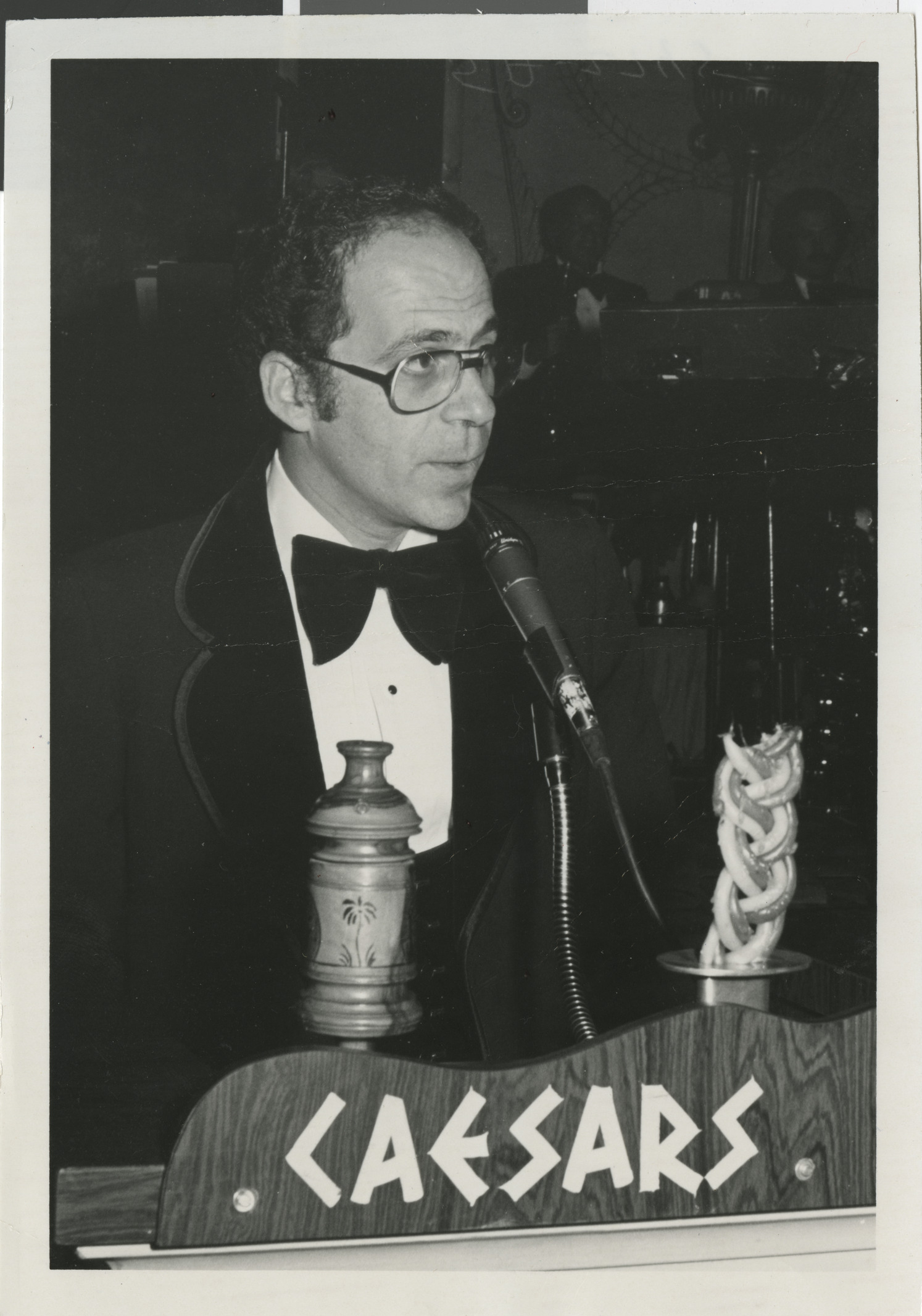 Photograph of Dennis Sabbath speaking at Caesars, date unknown